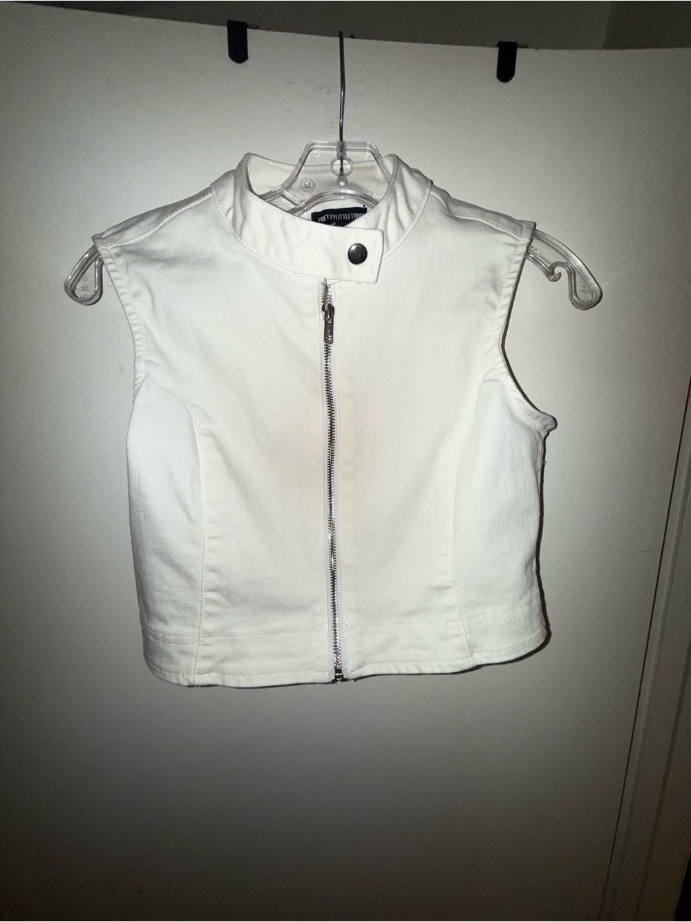 PrettyLittleThing White Sleeveless denim Crop Vest with Moto Zip.